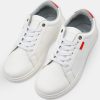 White Sneakers with Subtle Red Details
